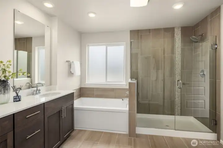 Second bathroom on upper with walk in shower and soaking tub.