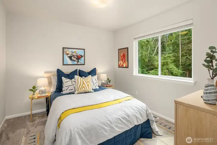 Third bedroom on upper overlooks back garden.