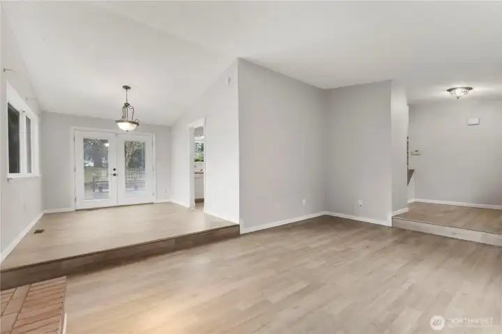 From living room, enter into dining area, and to rear french doors.