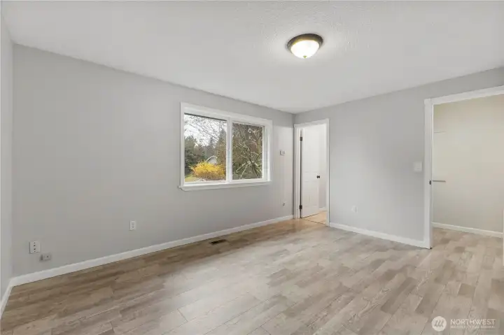 Primary ensuite, with 3/4 bathroom, and walk-in closet.