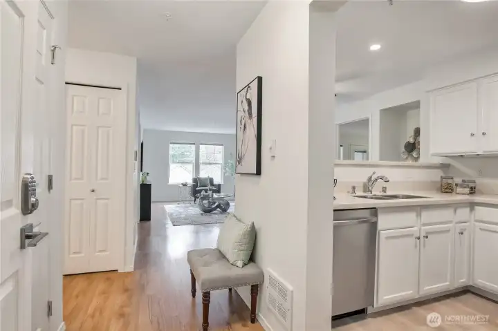Enter to beautiful condo with solid surface flooring throughout.