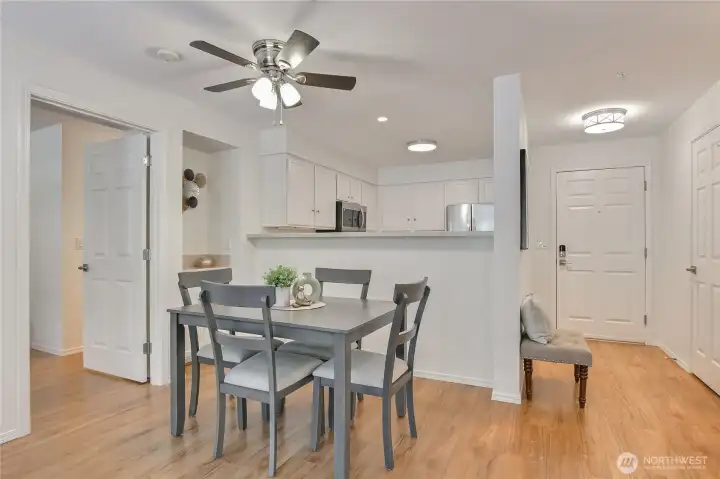 Nice dining space with solid surface floors open to kitchen.