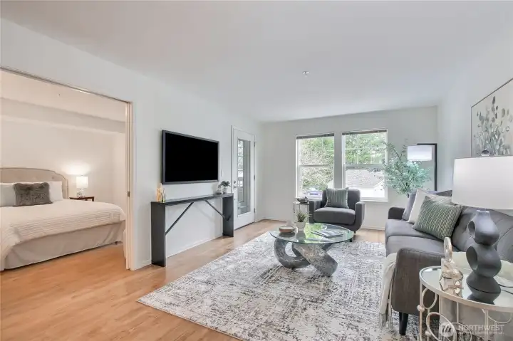 Spacious living room opens to covered deck space for outdoor living.