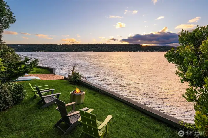 Level lawn, boat launch and buoy at water's edge
