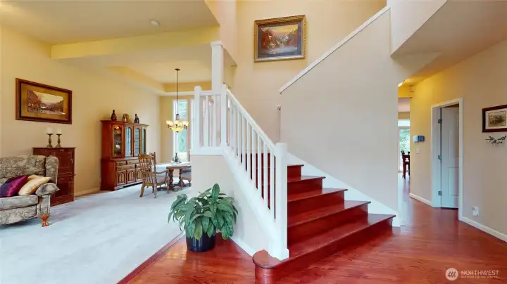 Expansive ceilings and hardwood floors greet you as you walk in