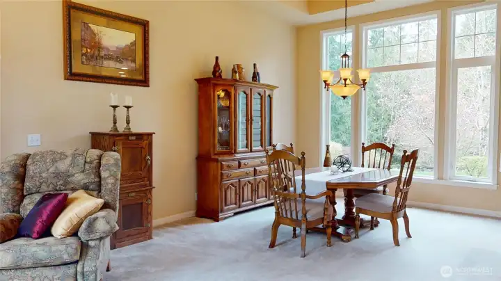 With an open room concept, the dining room sits adjacent to the formal living room