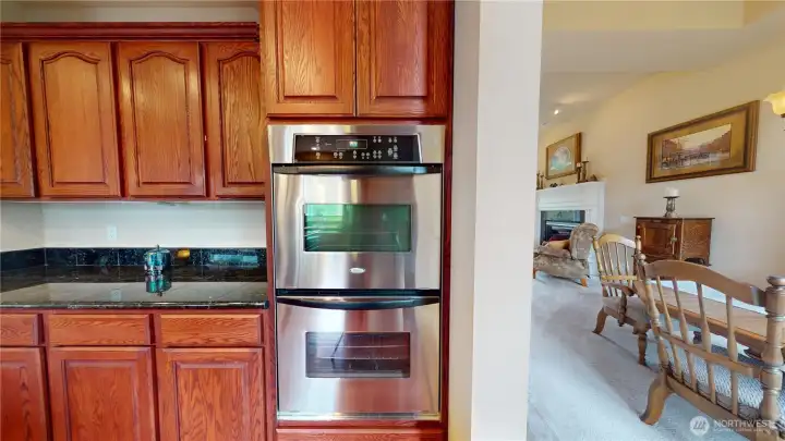 A double oven is a smart choice in this kitchen with stainless appliances