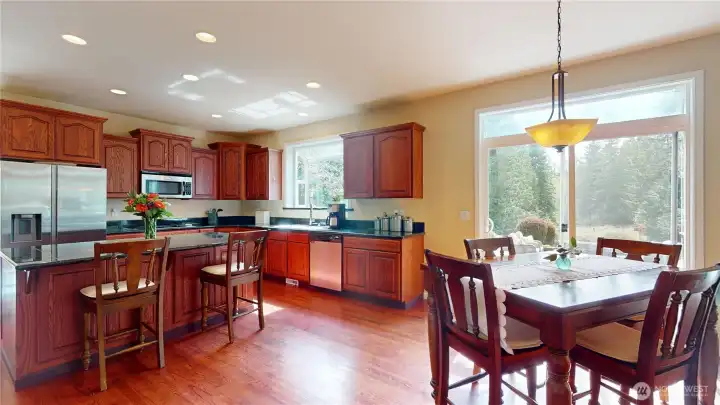 A breakfast nook sits off the slider to the backyard patio