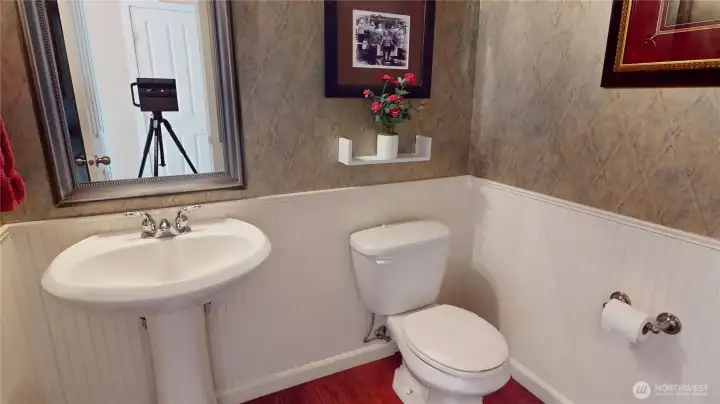 This half bath can be found in the hallway on the main floor