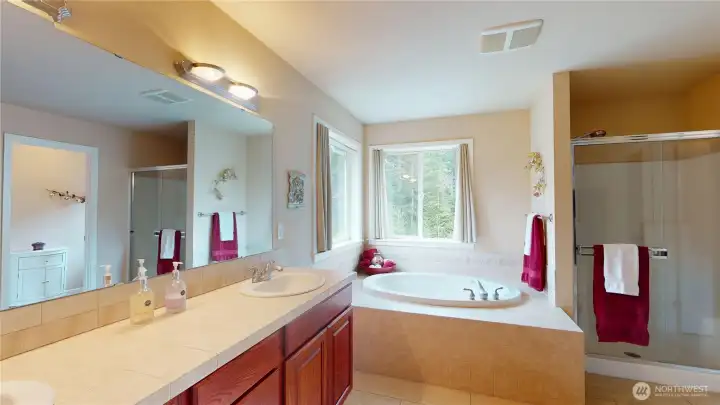 The primary 5-piece en suite includes double vanity, large soaking tub, separate shower, private water closet and massive walk-in closet