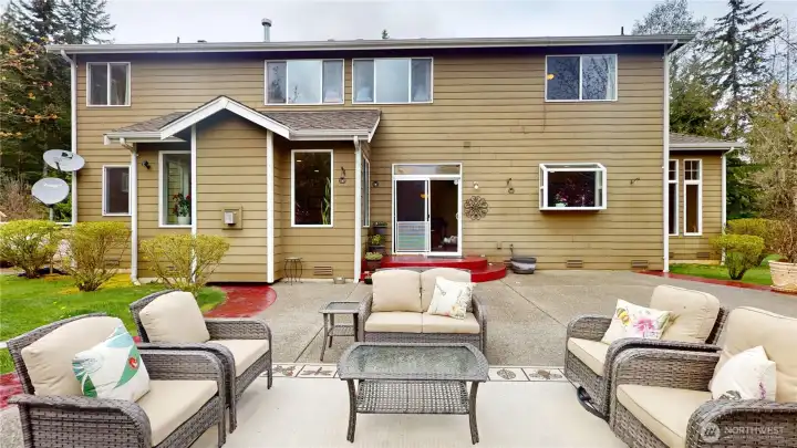 Entertain with ease on your gorgeous oversized patio with red concrete borders