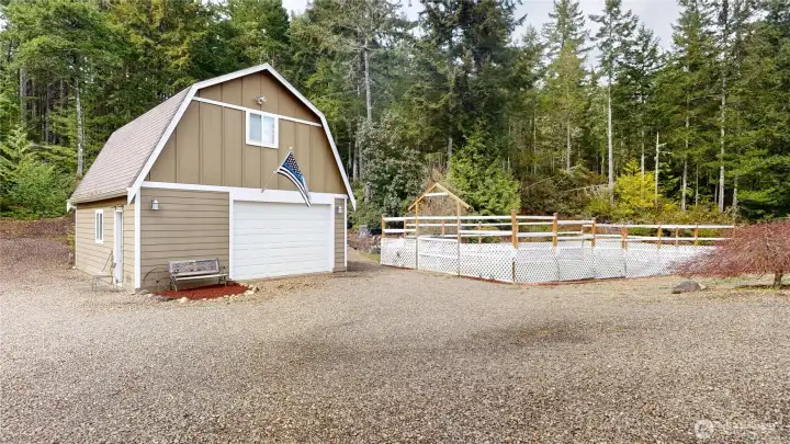 This additional detached garage has a studio upstairs, currently being used as a sound studio.