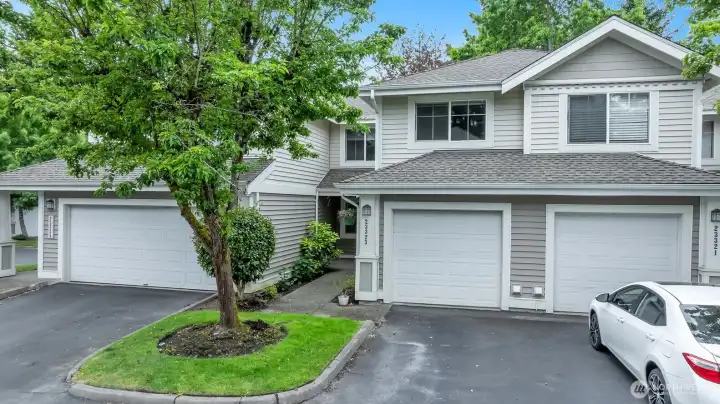 Highly desirable Promenade at The Lakes community framed by mature trees and manicured grounds.