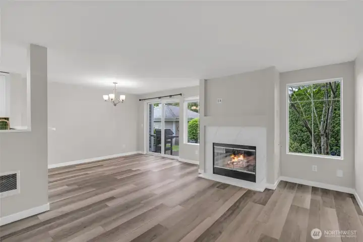The fireplace creates a natural focal point for the living room.