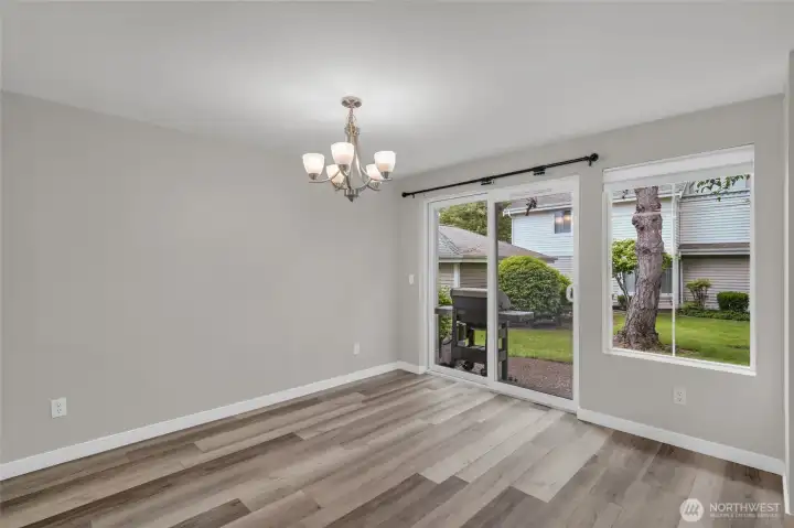 Sliding door access off the dining area to a private patio for effortless indoor-outdoor living.