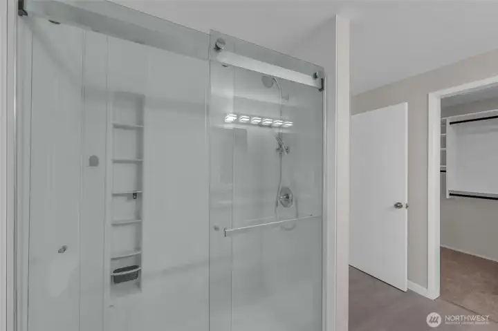 Modern bathroom featuring a large walk-in shower.