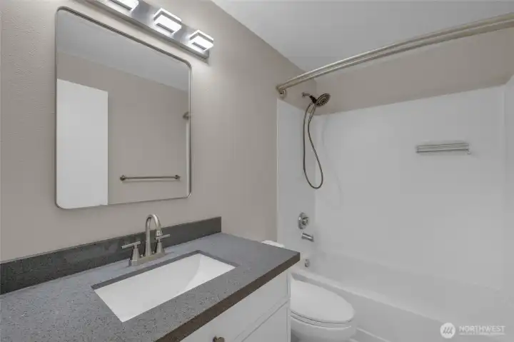 Modern bathroom with refreshed, clean finishes.