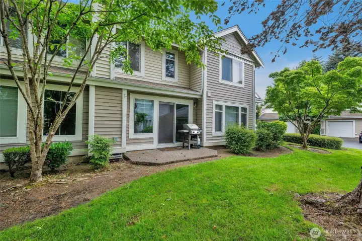 Private patio overlooking peaceful landscaped grounds.