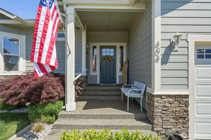 Exceptional curb appeal with craftsman-inspired architecture and manicured landscaping.