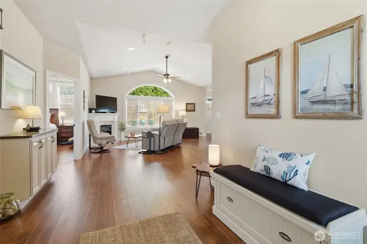 Bright and inviting entryway featuring durable laminate hardwood flooring and abundant natural light.