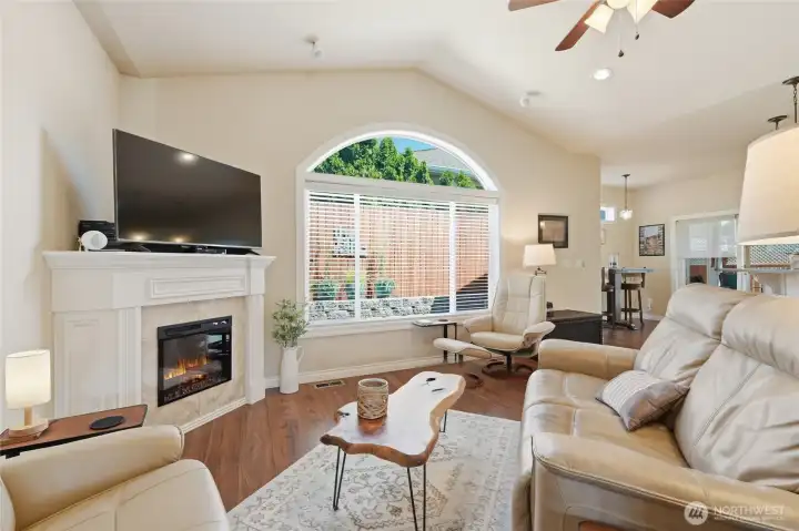 The fireplace creates a warm focal point for relaxing evenings year-round.
