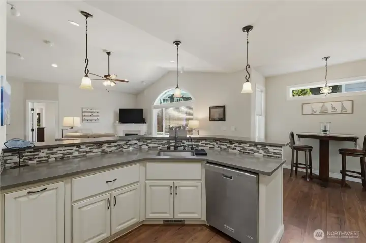 Oversized peninsula seating makes meal preparation and entertaining effortless.