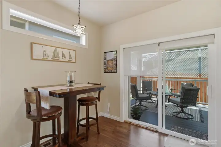Seamless indoor-outdoor flow from the kitchen and dining area to the covered patio.