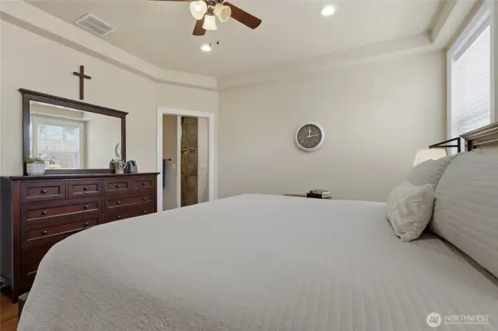Large primary bedroom designed for comfort, privacy, and relaxation.