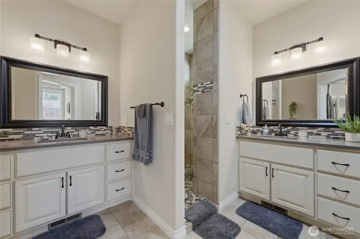 Separate his-and-her vanities provide convenience and functionality for daily living.