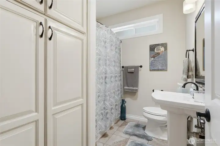 Full guest bathroom conveniently located near the secondary bedroom and main living spaces.