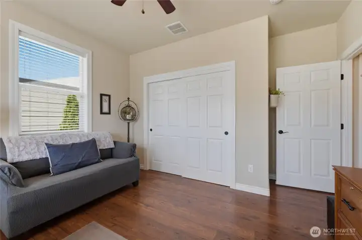 Flexible second bedroom ideal for guests, home office, hobby room, or den.