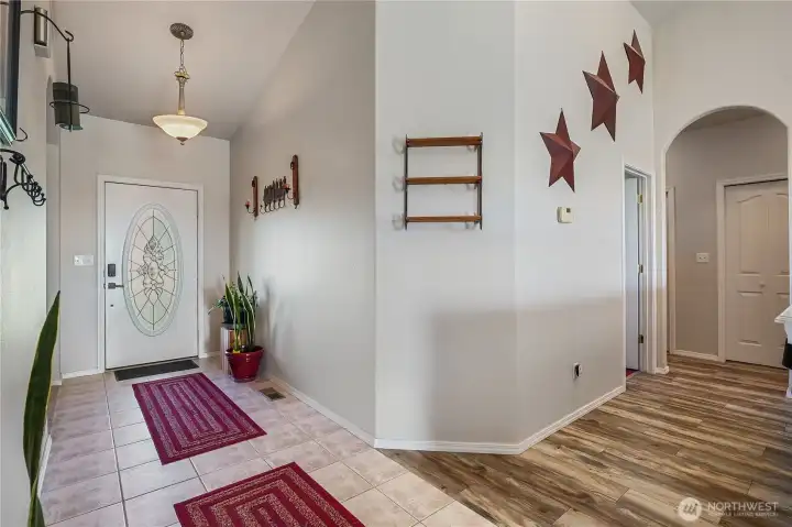 Bright entryway with easy flow into the living, dining, and kitchen spaces.