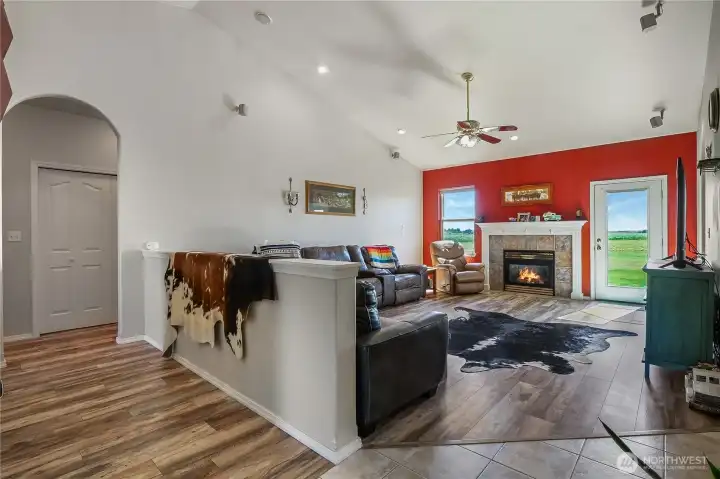 Open-concept living room with propane fireplace.