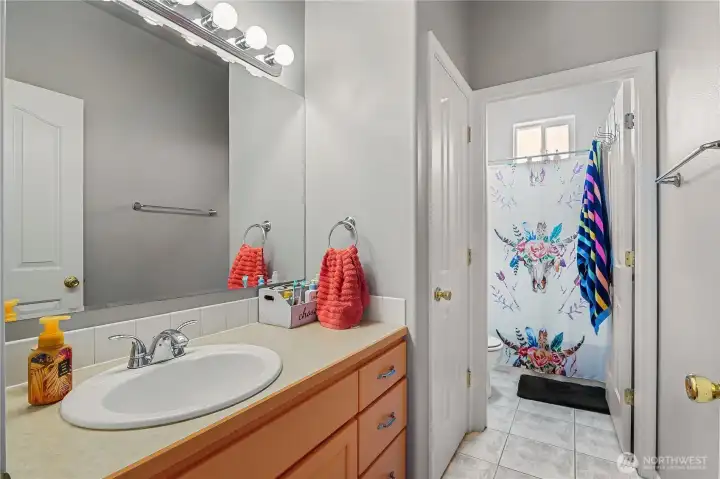 Full guest bathroom conveniently located for family and visitors.