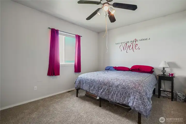 Comfortable secondary bedroom with natural light.