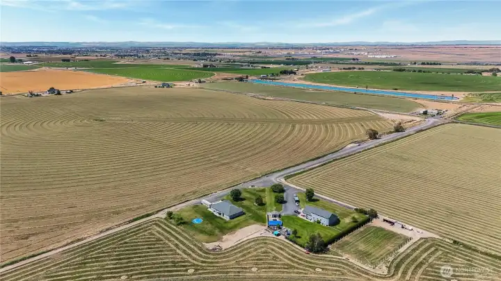 Peaceful rural setting surrounded by open farmland.