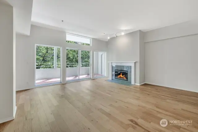 This stunning great room condo boasts a bright, spacious open floor plan with soaring expanding from the kitchen to the balcony!   10' ceilings and beautiful wide-plank engineered hardwood floors.