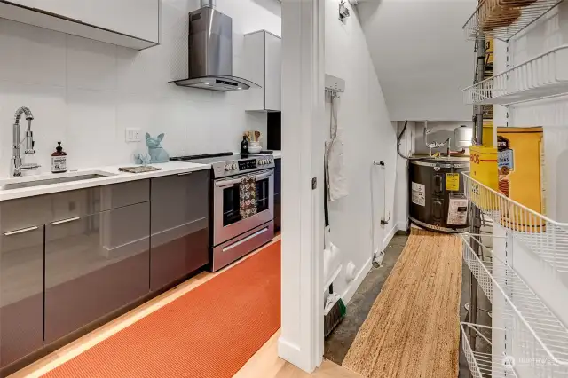 A walk-in pantry with built-in shelves has extra space for all your utility items or gear. The closet goes to the right of the water heater and has additional space under the stairs.