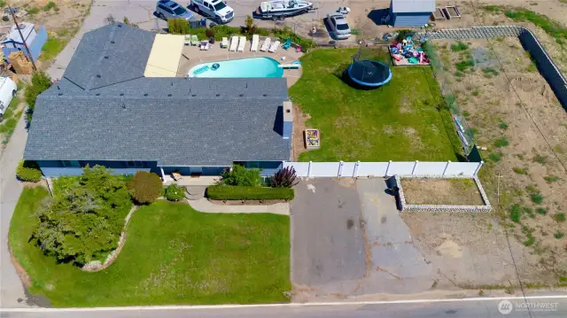 Aerial view of remodeled and updated 2550 sq ft ranch house, backyard pool and tons of room for expansion