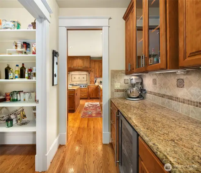 The Butlers Pantry has rich cabinets and granite counters to match the rest of the kitchen area. Comes with a wine refrigerator and walk-in pantry closet.