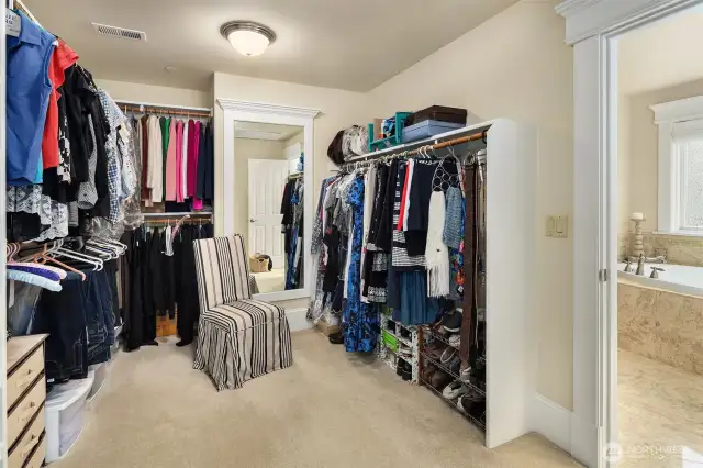 The huge walk-in closet off the master bathroom with custom built in organizers