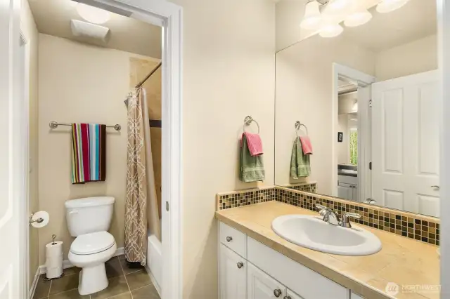 A nice upstairs Jack and Jill Bathroom with shower over the tub. Both the 3rd and 4th bedrooms have there  own separate sink area and cabinet space.