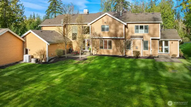 The spacious backyard area and two patio spaces off the back of the house.  The yard has sprinklers and the riding lawn mower comes with the house (sold as is).  Plenty of space for however you want to use it, put your vision to work