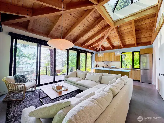 Light-filled guesthouse front room with kitchen on far wall