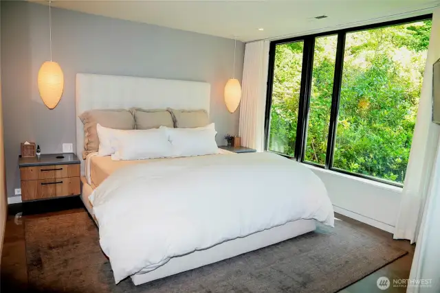 Guesthouse bedroom with views of the Sea and the forest.