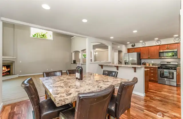 Kitchen nook on one side formal dining on the other
