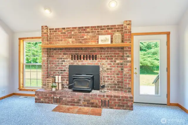 Vaulted ceilings and a big brick fireplace? Yes, please! The perfect spot to gather and unwind.