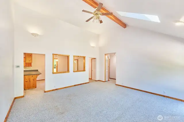This living room combines open space and rustic charm and is open to the dining room.