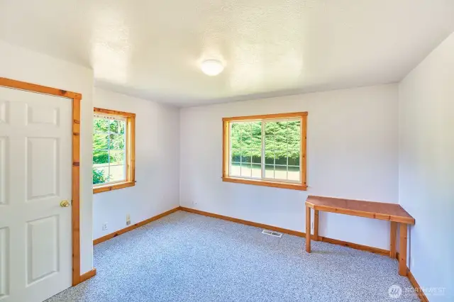 Bedroom #2 with large closet and faces east.