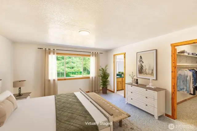 Spacious primary suite with large walk-in closet and big bathroom (virtually staged).